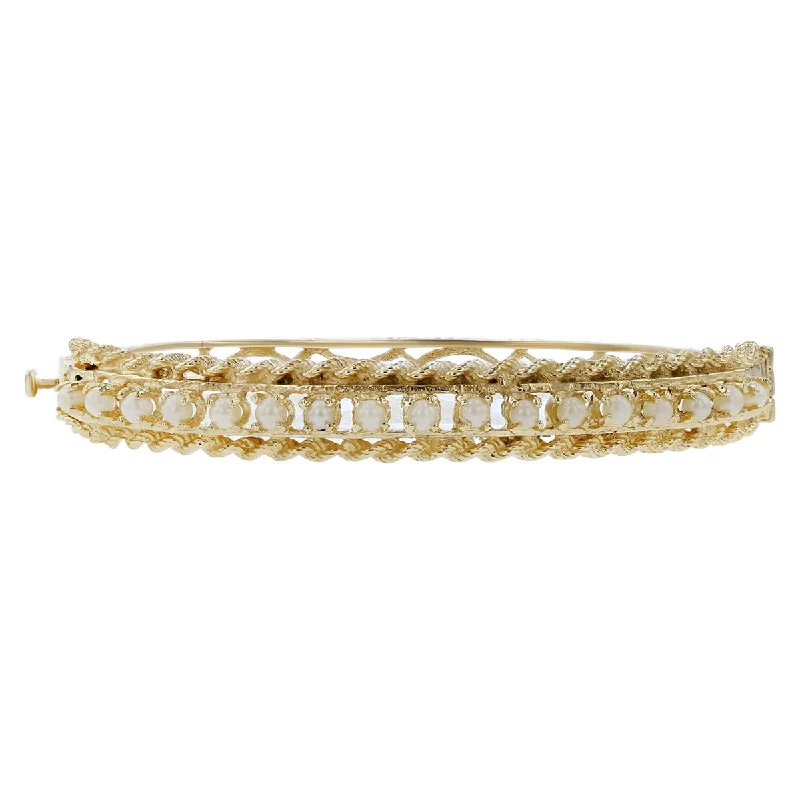 Ladies charm bracelets-14K Yellow Gold Pearl and Rope Border Bangle